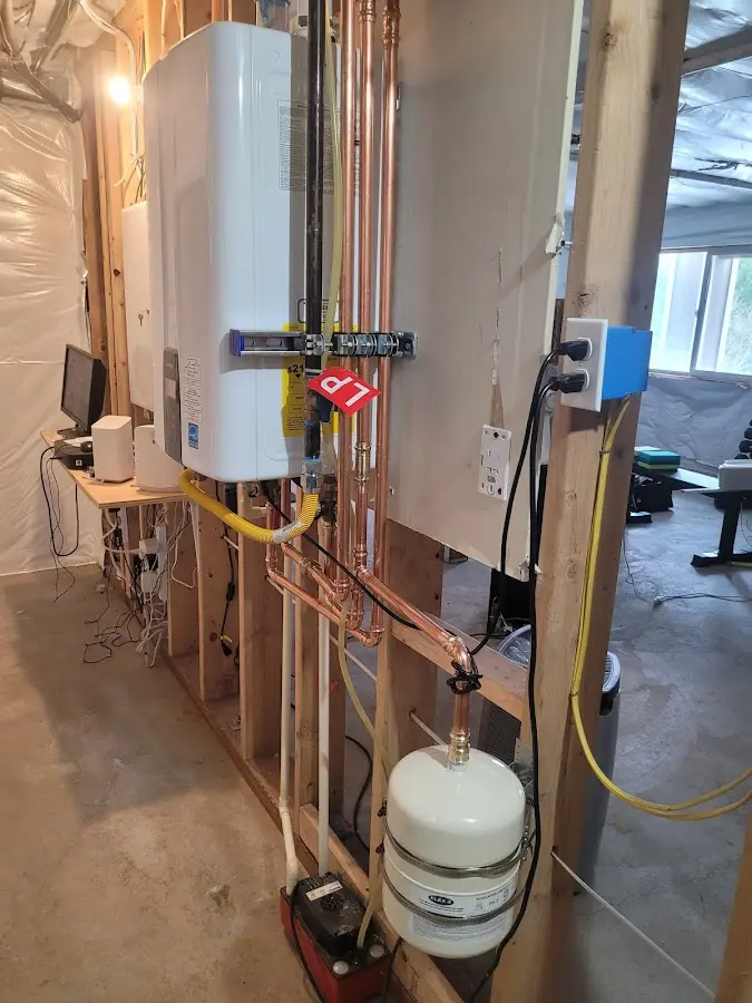 Licensed plumber repairing a kitchen sink in Iowa